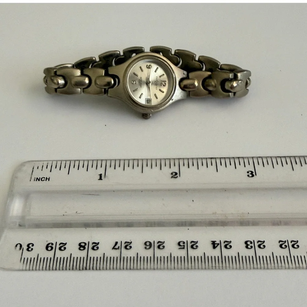 Express LAX1336 Wrist Watch Date Water Resist Silver Tone 7 Inch Womens